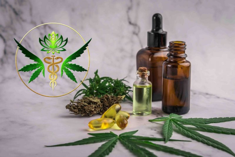 Tincture bottles, gel capsules, and cannabis leaves on a stone counter