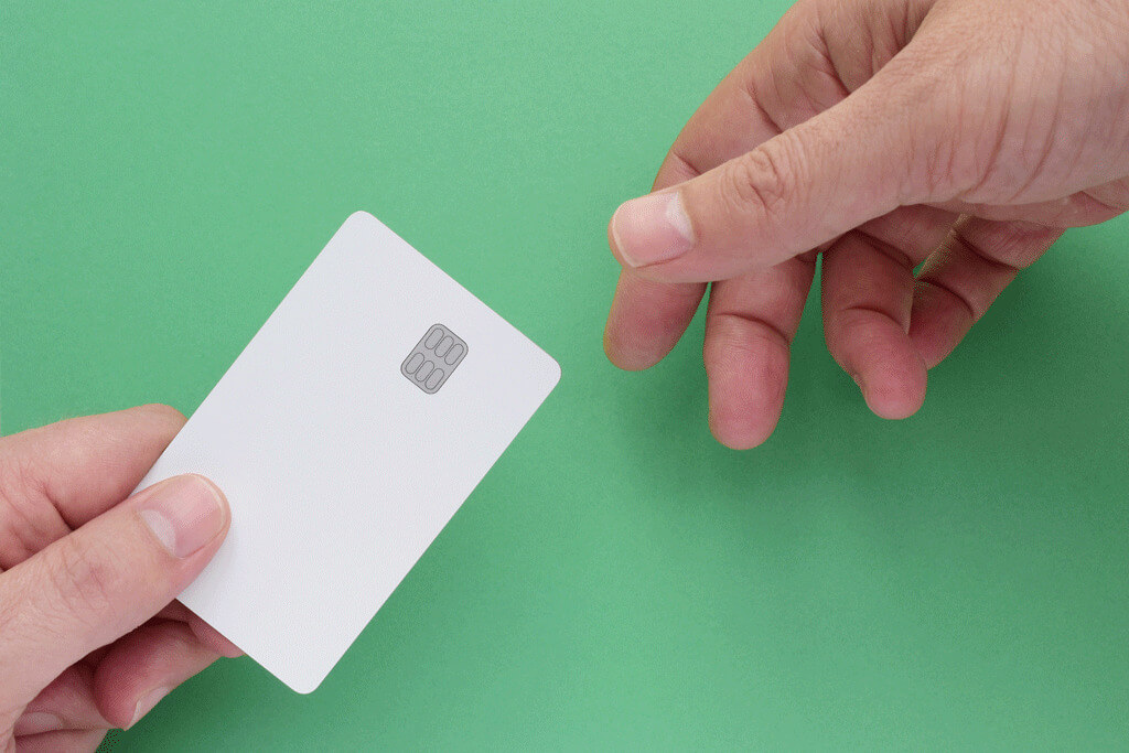 Hands Transferring Credit Card