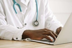 Doctor Reviewing Qualification of a Client