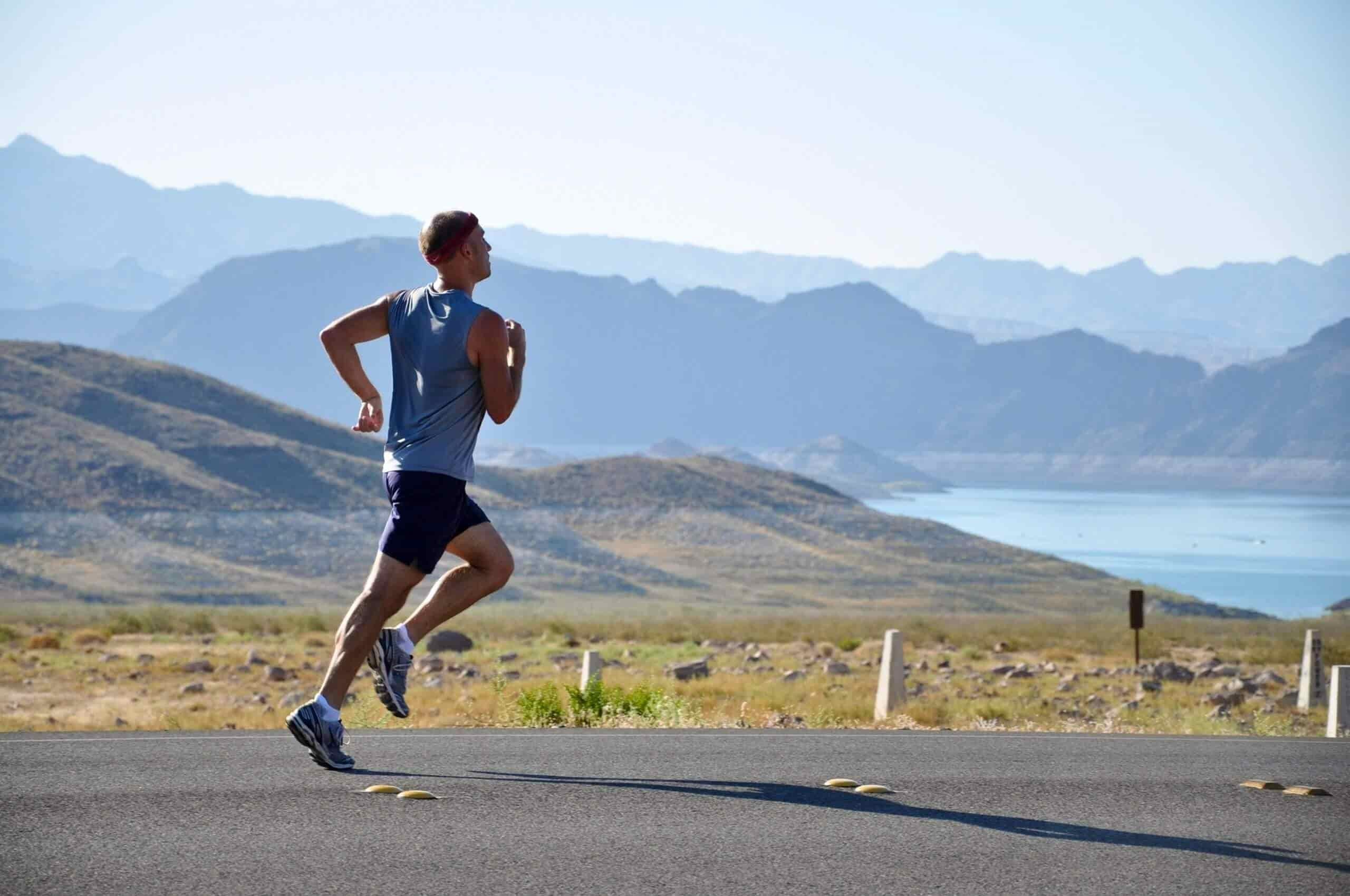 Man Running Along Mountain Road