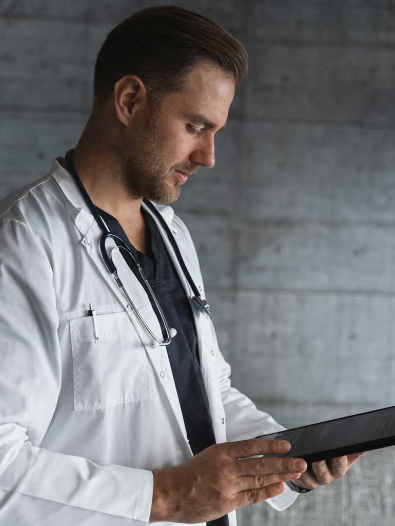 Doctor looking at a tablet