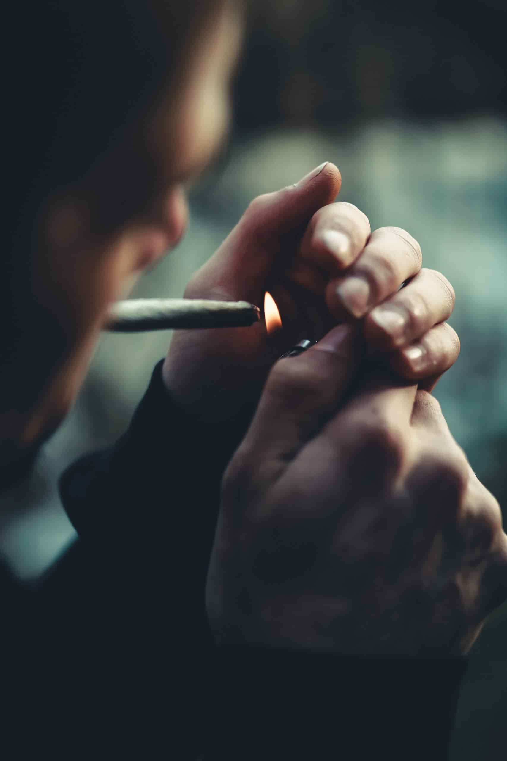 Man lighting a joint