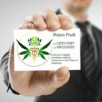 A man holding a medical marijuana card