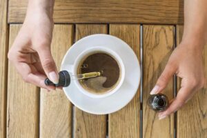 Adding CBD oil to coffee