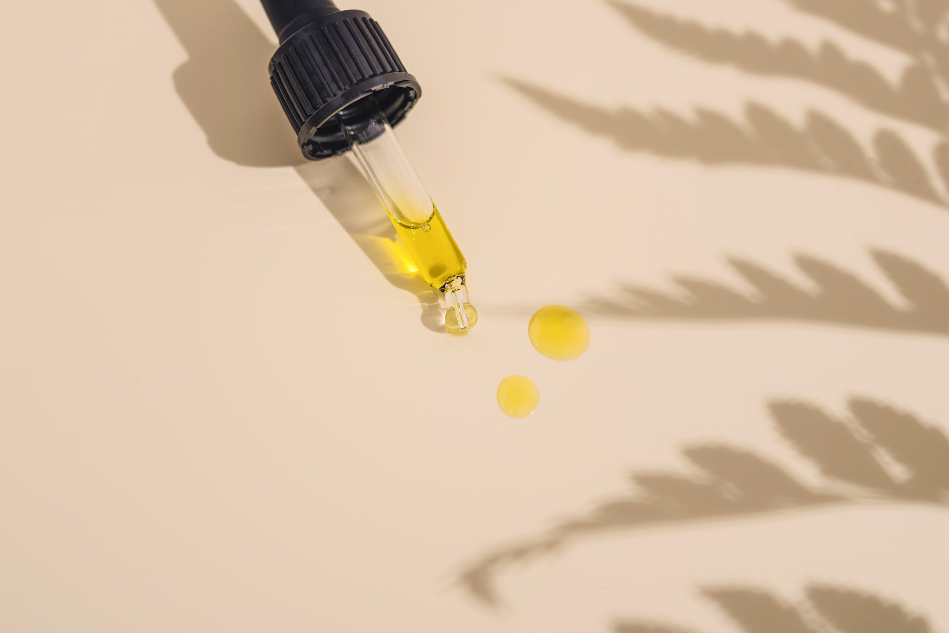 A glass dropper containing CBD oil