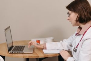 A female doctor using her laptop