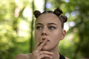 A young woman smoking weed