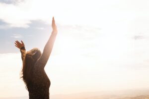 A woman raising her hands