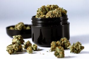 Cannabis buds in a black container