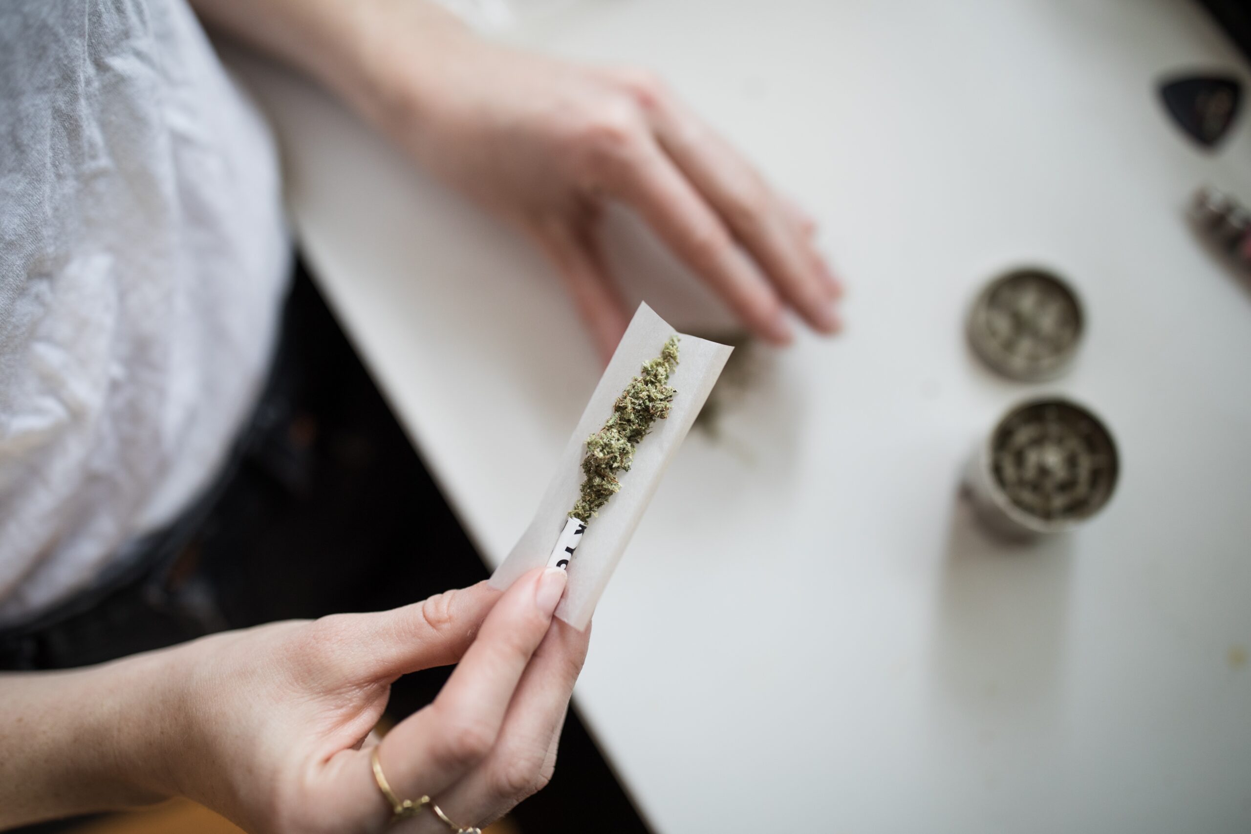 A person rolling a cannabis joint