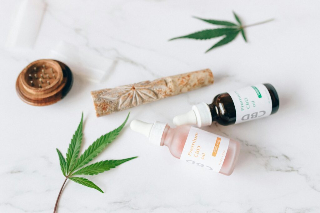 Cannabis leaves near CBD oils