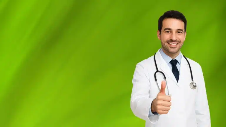 Smiling medical marijuana doctor in Spring Hill giving a thumbs up on a green background.