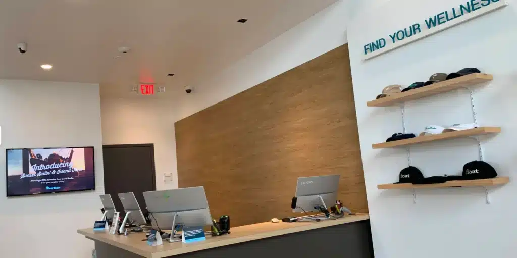 Interior of a modern Surterra Wellness medical marijuana dispensary in Florida with a clean checkout area and wellness displays.