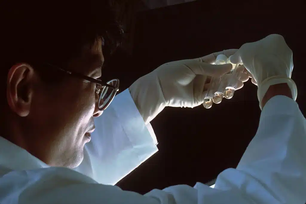 Scientist examining laboratory samples and medical data, investigating critical questions such as Can You Get HIV from Someone Who Is Undetectable?