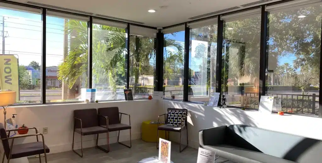 Interior of a modern Medical Marijuana Dispensary in Florida with a comfortable waiting area and natural light.